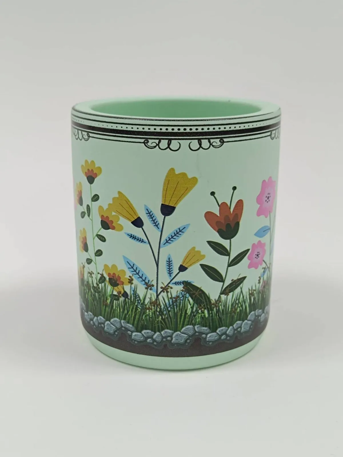 A mint candle jar printed with full-colour flowers